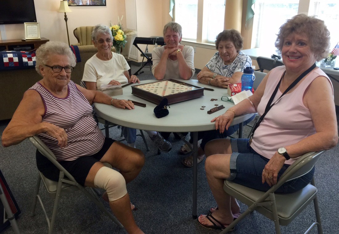 women playing a board game together